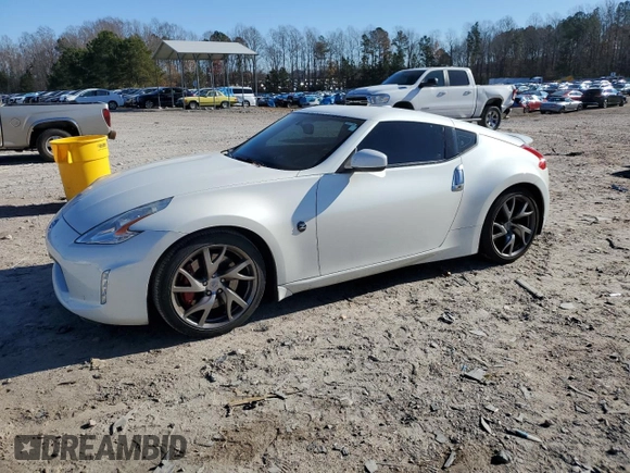 2014 Nissan 370Z Touring with VIN JN1AZ4EH1EM635411, listed as a Copart auction lot 82670344 with 77,501 mi miles and Salvage Title. Bid and sale history available at carsss.com. Image 1.