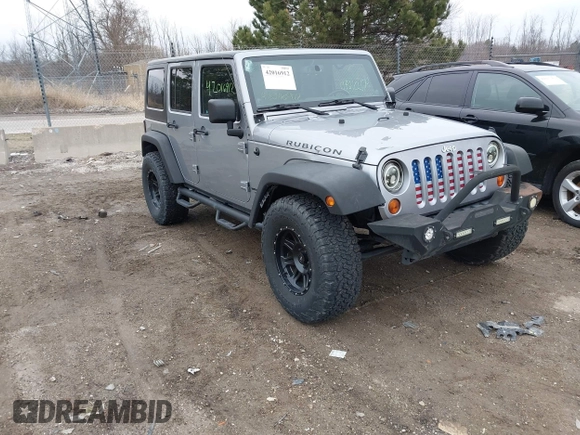2013 Jeep Wrangler Unlimited Rubicon z VIN 1C4BJWFG7DL667083, wystawiony jako IAAI lot #42016912 z przebiegiem 148 933 mil mil oraz . Historia ofert i sprzedaży dostępna na DreamBid. Obrazek 1.