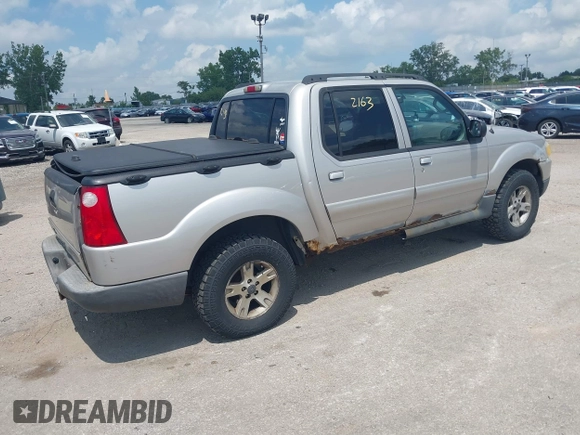 2005 Ford Explorer Sport Trac XLS z VIN 1FMZU77K15UB67801, wystawiony jako IAAI lot #42822163 z przebiegiem 179 102 mil mil oraz . Historia ofert i sprzedaży dostępna na DreamBid. Obrazek 4.