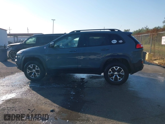 2014 Jeep Cherokee Trailhawk z VIN 1C4PJMBS2EW212341, wystawiony jako IAAI lot #40672694 z przebiegiem 108 622 mil mil oraz . Historia ofert i sprzedaży dostępna na DreamBid. Obrazek 14.