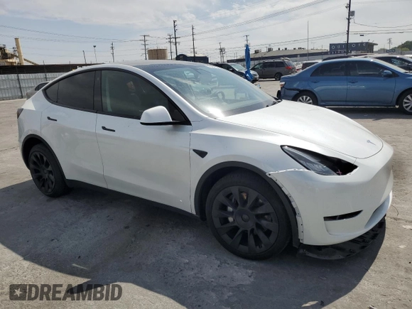 2023 Tesla Model Y Long Range z VIN 7SAYGDEE8PA030286, wystawiony jako Copart lot #50945465 z przebiegiem 43 676 mil mil oraz Szkoda całkowita • Salvage title. Historia ofert i sprzedaży dostępna na DreamBid. Obrazek 4.