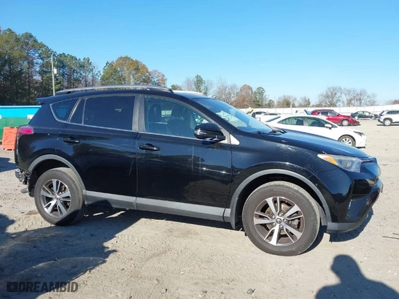 2018 Toyota RAV4 XLE with VIN 2T3RFREV9JW793956, listed as a IAAI auction lot 41012152 with 77,033 mi miles. Bid and sale history available at carsss.com. Image 14.