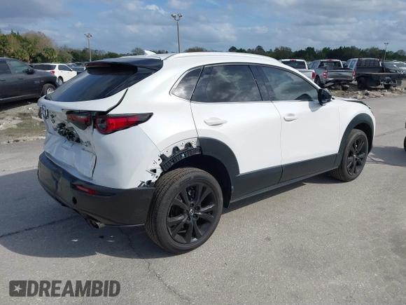 2022 Mazda CX-30 2.5 Turbo Premium Package with VIN 3MVDMBDY3NM437897, listed as a IAAI auction lot 41715776 with 42,771 mi miles. Bid and sale history available at carsss.com. Image 4.