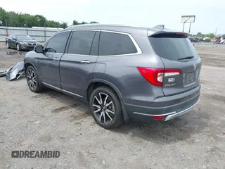 2019 Honda Pilot Touring 8-Passenger with VIN 5FNYF5H93KB028641, listed as a IAAI auction lot 42524078 with 56,744 mi miles and . Bid and sale history available at DreamBid. Image 3.