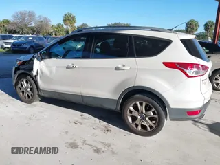 2015 Ford Escape Titanium with VIN 1FMCU0J96FUA48615, listed as a IAAI auction lot 39482355 with 186,340 mi miles and . Bid and sale history available at DreamBid. Image 3.