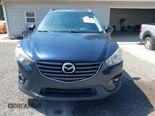 2016 Mazda CX-5 Grand Touring with VIN JM3KE4DY5G0681369, listed as a IAAI auction lot 42102805 with 128,182 mi miles and . Bid and sale history available at DreamBid. Image 12.