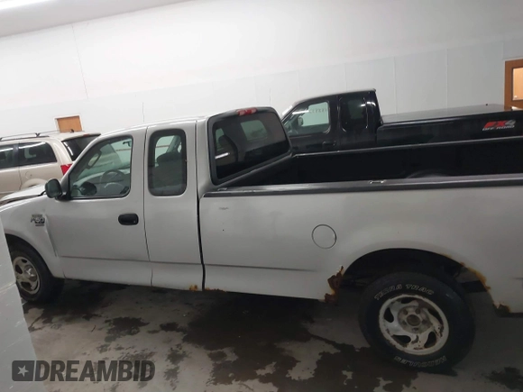 2002 Ford F-150 XL with VIN 1FTRX17W52NB23883, listed as a IAAI auction lot 41721680 with 144,115 mi miles. Bid and sale history available at carsss.com. Image 14.