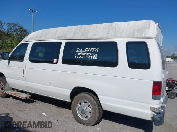 2012 Ford Econoline Cargo Commercial with VIN 1FTNS2EW4CDA50633, listed as a IAAI auction lot 40694015 with 309,334 mi miles. Bid and sale history available at carsss.com. Image 14.
