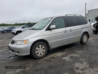 2003 Honda Odyssey EX z VIN 5FNRL18603B008148, wystawiony jako Copart lot #60669825 z przebiegiem 128 115 mil mil oraz Czysty tytuł • Clean title. Historia ofert i sprzedaży dostępna na DreamBid. Obrazek 1.
