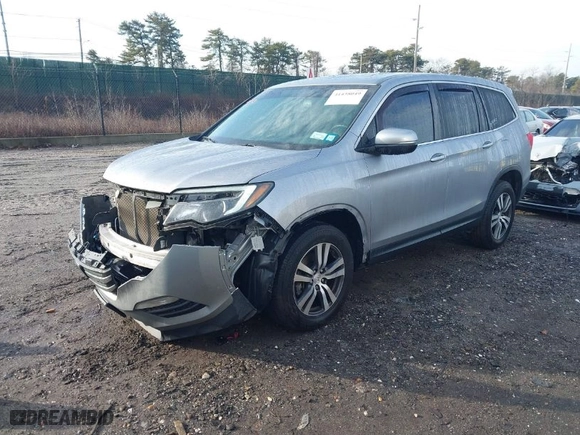 2018 Honda Pilot EX-L with VIN 5FNYF6H59JB026068, listed as a IAAI auction lot 41458049 with 128,769 mi miles. Bid and sale history available at carsss.com. Image 2.