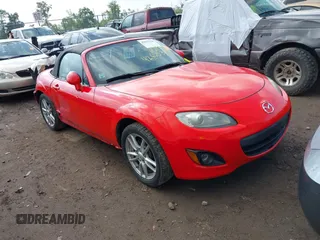 2011 Mazda MX-5 Miata Sport with VIN JM1NC2JF7B0218824, listed as a IAAI auction lot 42675310 with 137,493 mi miles and . Bid and sale history available at DreamBid. Image 1.
