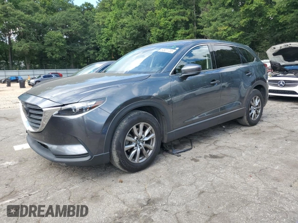 2019 Mazda CX-9 Touring with VIN JM3TCACY6K0334121, listed as a Copart auction lot 64901735 with 112,328 mi miles and Salvage title. Bid and sale history available at DreamBid. Image 1.