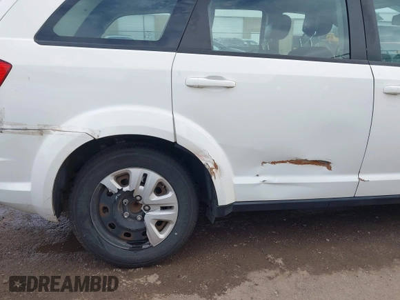 2014 Dodge Journey American Value with VIN 3C4PDCAB1ET209973, listed as a IAAI auction lot 41803864 with 168,774 mi miles and . Bid and sale history available at DreamBid. Image 6.