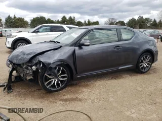 2014 Scion tC z VIN JTKJF5C73E3082796, wystawiony jako Copart lot #52996135 z przebiegiem 136 311 mil mil oraz Szkoda całkowita • Salvage title. Historia ofert i sprzedaży dostępna na DreamBid. Obrazek 1.