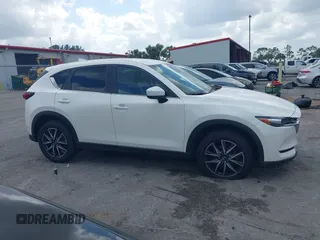 2018 Mazda CX-5 Touring z VIN JM3KFACM6J1419663, wystawiony jako IAAI lot #41879677 z przebiegiem 115 224 mil mil oraz . Historia ofert i sprzedaży dostępna na DreamBid. Obrazek 13.