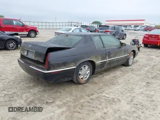 1997 Cadillac Eldorado ESC with VIN 1G6EL12Y8VU617784, listed as a IAAI auction lot 42214333 with Not Provided miles and . Bid and sale history available at DreamBid. Image 4.