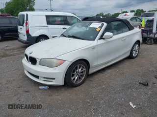 2010 BMW 1 Series 128i with VIN WBAUL7C52AVJ77773, listed as a IAAI auction lot 42146261 with 91,777 mi miles and . Bid and sale history available at carsss.com. Image 2.