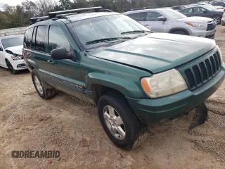 1999 Jeep Grand Cherokee Limited with VIN 1J4GW68S1XC744666, listed as a Copart auction lot 88337895 with 243,480 mi miles and Salvage Title. Bid and sale history available at carsss.com. Image 4.
