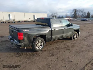 2015 Chevrolet Silverado 1500 LT with VIN 3GCUKREC6FG234389, listed as a IAAI auction lot 41008340 with 120,718 mi miles. Bid and sale history available at carsss.com. Image 4.