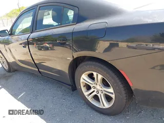 2015 Dodge Charger SE with VIN 2C3CDXBG9FH790573, listed as a IAAI auction lot 42142908 with 195,182 mi miles and . Bid and sale history available at carsss.com. Image 17.