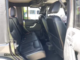 2014 Jeep Wrangler Unlimited Rubicon с VIN 1C4BJWFG2EL279938, выставлен на аукционе IAAI как лот 41920729 с пробегом 76 418 миль миль и . История ставок и продаж доступна на DreamBid. Изображение 8.