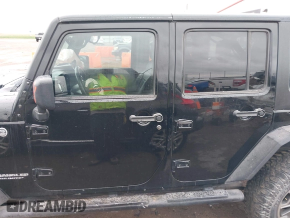 2012 Jeep Wrangler Unlimited Rubicon with VIN 1C4HJWFGXCL142804, listed as a IAAI auction lot 42183960 with 124,392 mi miles and . Bid and sale history available at DreamBid. Image 14.