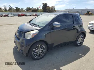 2012 Scion iQ with VIN JTNJJXB0XCJ009516, listed as a Copart auction lot 52640455 with 145,166 mi miles and Salvage title. Bid and sale history available at DreamBid. Image 1.