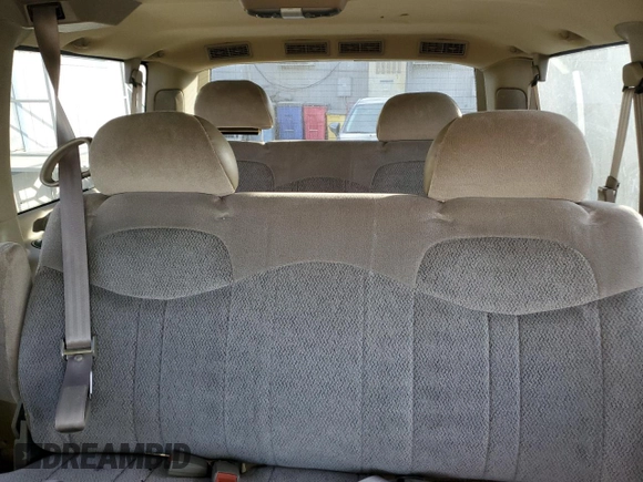 1999 GMC Safari z VIN 1GKDM19W2XB502093, wystawiony jako Copart lot #81719764 z przebiegiem 107 191 mil mil oraz Tytuł czysty. Historia ofert i sprzedaży dostępna na DreamBid. Obrazek 10.