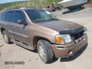 2003 GMC Envoy SLT with VIN 1GKDS13S832208655, listed as a IAAI auction lot 42076668 with 160,787 mi miles. Bid and sale history available at carsss.com. Image 1.