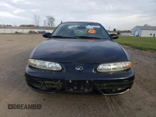 1999 Oldsmobile Alero GL z VIN 1G3NL52E3XC327519, wystawiony jako Copart lot #79273394 z przebiegiem 63 081 mil mil oraz Czysty tytuł • Clean title. Historia ofert i sprzedaży dostępna na DreamBid. Obrazek 5.