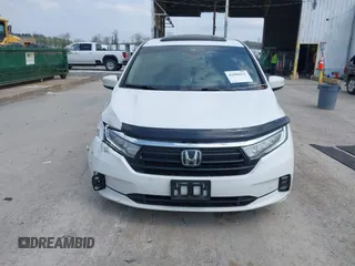 2021 Honda Odyssey Touring with VIN 5FNRL6H80MB010952, listed as a IAAI auction lot 42080412 with 90,594 mi miles and . Bid and sale history available at DreamBid. Image 12.