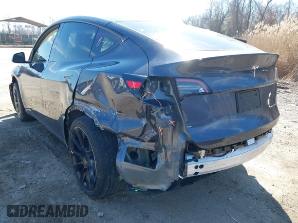 2023 Tesla Model Y Long Range with VIN 7SAYGDEE2PF883687, listed as a IAAI auction lot 41589837 with 36,890 mi miles. Bid and sale history available at carsss.com. Image 21.