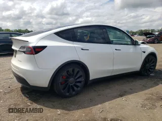 2022 Tesla Model Y Performance z VIN 7SAYGDEF4NF389191, wystawiony jako Copart lot #61443135 z przebiegiem 70 612 mil mil oraz Szkoda całkowita • Salvage title. Historia ofert i sprzedaży dostępna na DreamBid. Obrazek 3.