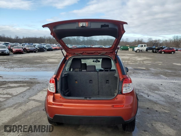 2013 Suzuki SX4 Crossover z VIN JS2YB5A37D6100222, wystawiony jako Copart lot #86614504 z przebiegiem 131 930 mil mil oraz Szkoda całkowita • Salvage title. Historia ofert i sprzedaży dostępna na DreamBid. Obrazek 6.