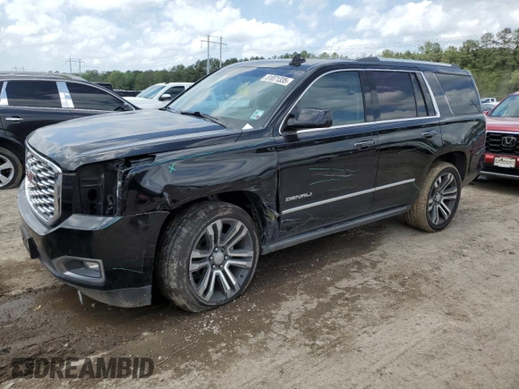 2019 GMC Yukon Denali with VIN 1GKS1CKJ0KR259491, listed as a Copart auction lot 51071335 with 105,294 mi miles and Salvage Title. Bid and sale history available at carsss.com. Image 1.