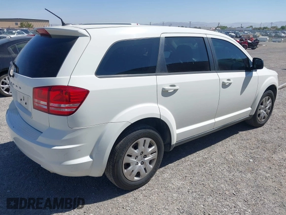 2014 Dodge Journey SE with VIN 3C4PDCAB4ET193896, listed as a IAAI auction lot 42126565 with 242,108 mi miles and . Bid and sale history available at carsss.com. Image 4.