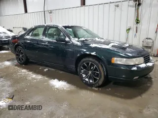 2000 Cadillac Seville Touring STS z VIN 1G6KY5494YU220613, wystawiony jako Copart lot #87338724 z przebiegiem 106 313 mil mil oraz Szkoda całkowita • Salvage title. Historia ofert i sprzedaży dostępna na DreamBid. Obrazek 4.