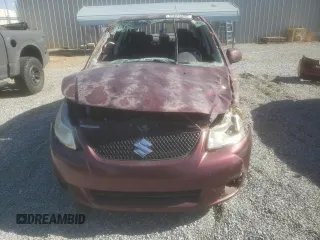 2011 Suzuki SX4 LE with VIN JS2YC5A21B6303222, listed as a Copart auction lot 50426895 with 56,236 mi miles and Salvage Title. Bid and sale history available at carsss.com. Image 5.