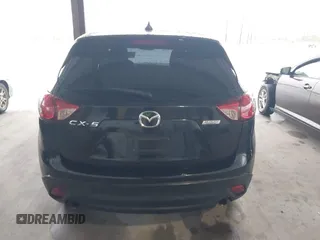 2016 Mazda CX-5 Touring with VIN JM3KE2CY2G0808424, listed as a IAAI auction lot 41880494 with 149,005 mi miles. Bid and sale history available at carsss.com. Image 16.