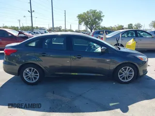 2018 Ford Focus SE z VIN 1FADP3F27JL245603, wystawiony jako IAAI lot #41773395 z przebiegiem 94 044 mil mil oraz . Historia ofert i sprzedaży dostępna na DreamBid. Obrazek 13.