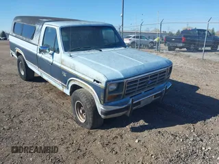 1986 Ford F-150 with VIN 1FTEF14N0GPA37633, listed as a IAAI auction lot 42084341 with 230,894 mi miles. Bid and sale history available at carsss.com. Image 1.