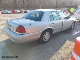 2005 Ford Crown Victoria LX with VIN 2FAFP74W85X121984, listed as a IAAI auction lot 41427678 with 113,437 mi miles. Bid and sale history available at carsss.com. Image 4.
