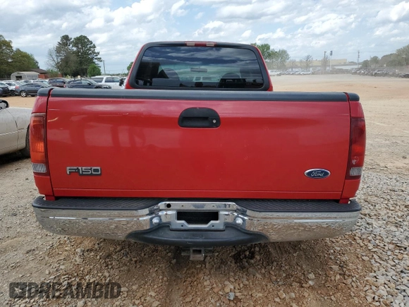 1999 Ford F-150 with VIN 1FTZX1725XNA33332, listed as a Copart auction lot 51867455 with 163,023 mi miles and Salvage title. Bid and sale history available at DreamBid. Image 6.