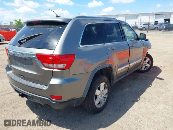 2011 Jeep Grand Cherokee Laredo with VIN 1J4RR4GGXBC587911, listed as a IAAI auction lot 42156885 with 178,999 mi miles and . Bid and sale history available at DreamBid. Image 4.