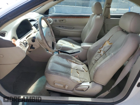 2002 Toyota Solara SE with VIN 2T1CF28P82C601593, listed as a Copart auction lot 60487005 with 137,624 mi miles and Salvage title. Bid and sale history available at DreamBid. Image 7.
