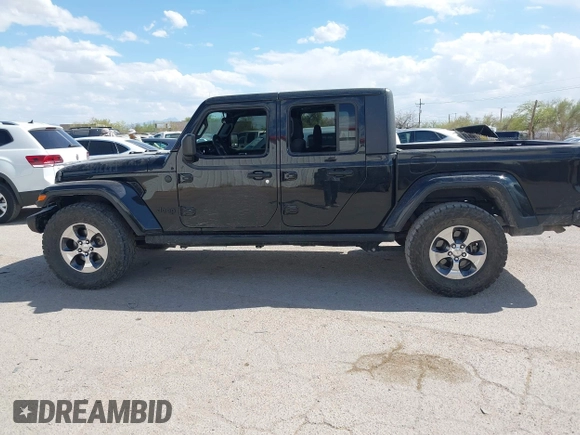 2021 Jeep Gladiator Willys with VIN 1C6HJTAG7ML523718, listed as a IAAI auction lot 42206058 with 48,071 mi miles and . Bid and sale history available at DreamBid. Image 14.