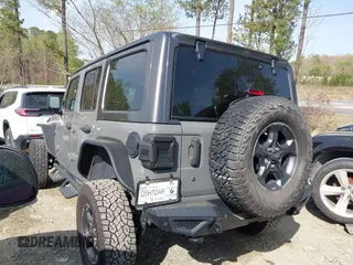 2019 Jeep Wrangler Unlimited Sport Altitude with VIN 1C4HJXDG3KW639148, listed as a IAAI auction lot 41933844 with 57,184 mi miles and . Bid and sale history available at DreamBid. Image 14.