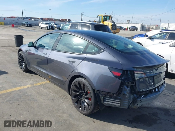 2023 Tesla Model 3 Performance with VIN 5YJ3E1EC4PF705449, listed as a IAAI auction lot 41587026 with 30,292 mi miles. Bid and sale history available at carsss.com. Image 3.