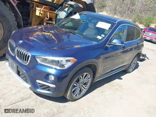 2017 BMW X1 xDrive28i with VIN WBXHT3C33H5F82035, listed as a IAAI auction lot 41944399 with 102,942 mi miles. Bid and sale history available at carsss.com. Image 17.