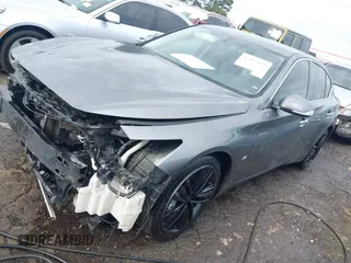 2014 Infiniti Q50 Premium with VIN JN1BV7AP8EM693109, listed as a IAAI auction lot 42183699 with 171,981 mi miles and . Bid and sale history available at DreamBid. Image 2.